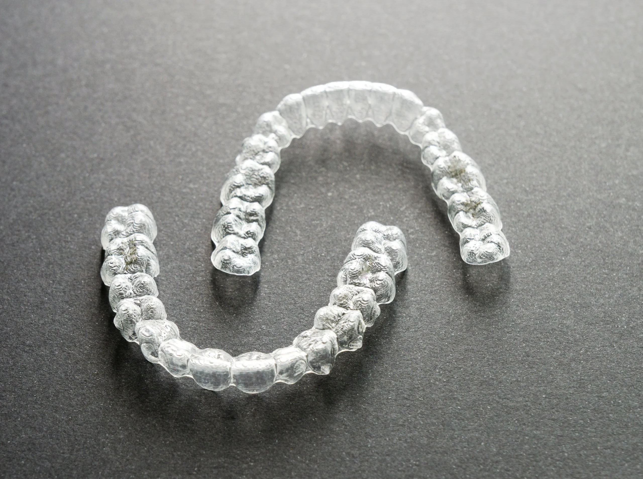 Custom clear aligners for teeth straightening and orthodontic treatment at Dr. Pawar's Advanced Dentistry in Thane West.