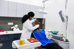 Specialist dentist conducting a thorough patient consultation and examination at Dr. Pawar's Advanced Dentistry in Thane West