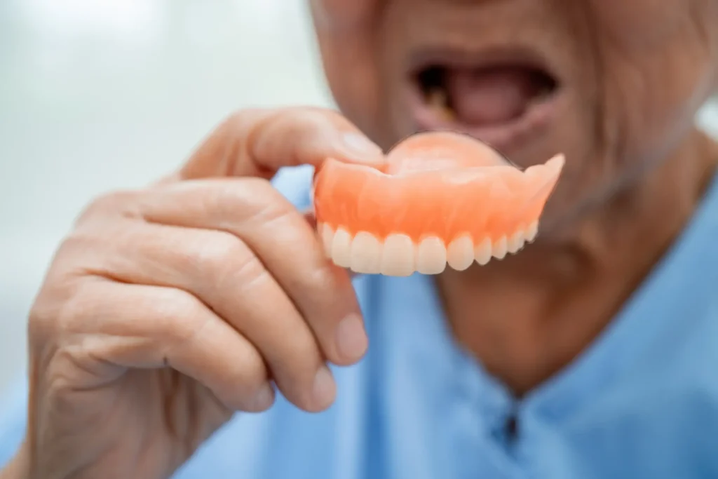 Full set of upper and lower acrylic dentures by dentist Dr. Pawar in Thane West