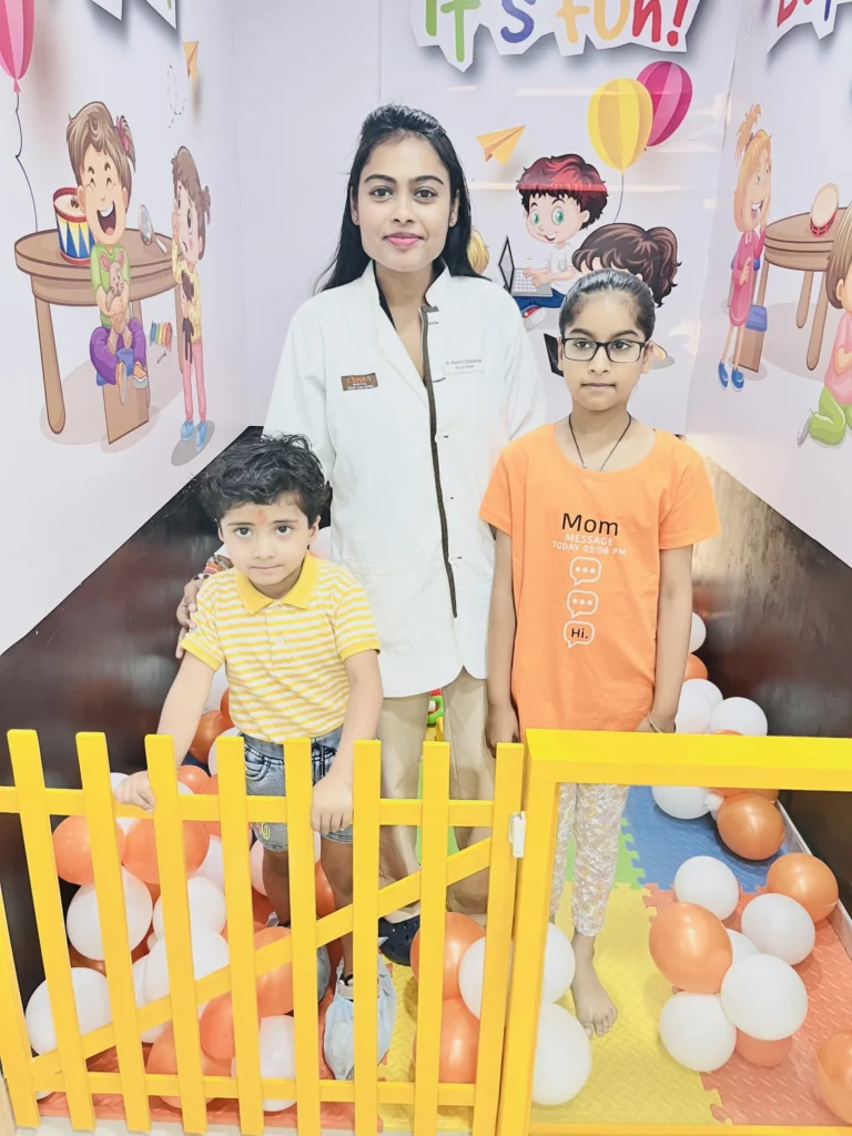 Happy family and child with the pediatric dentist at Dr. Pawar's painless kids dentistry clinic in Thane West