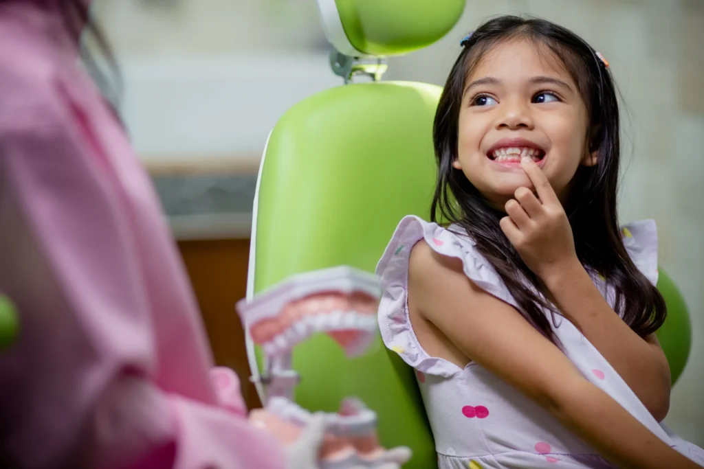 Happy child at a painless kids dentistry clinic in Thane West
