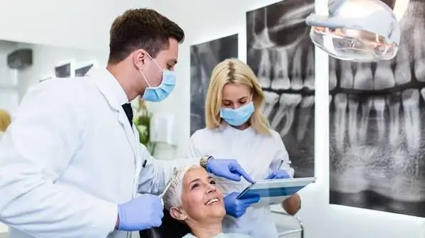 Dentist in Thane West Dentist discussing planned appointments and treatment steps with a patient at Dr. Pawar's Advanced Dentistry in Thane West