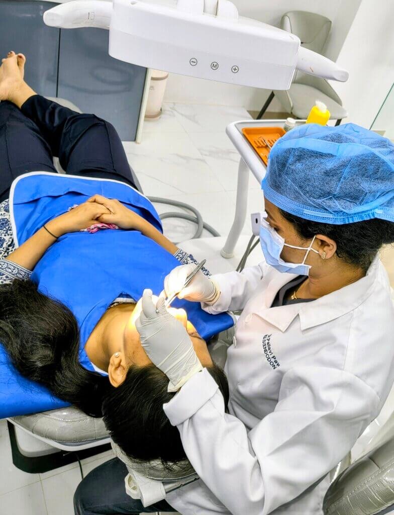Dentist in Thane West Endodontist performing a painless re-root canal treatment (Re-RCT) procedure to save a natural tooth at Dr. Pawar's Advanced Dentistry in Thane West.