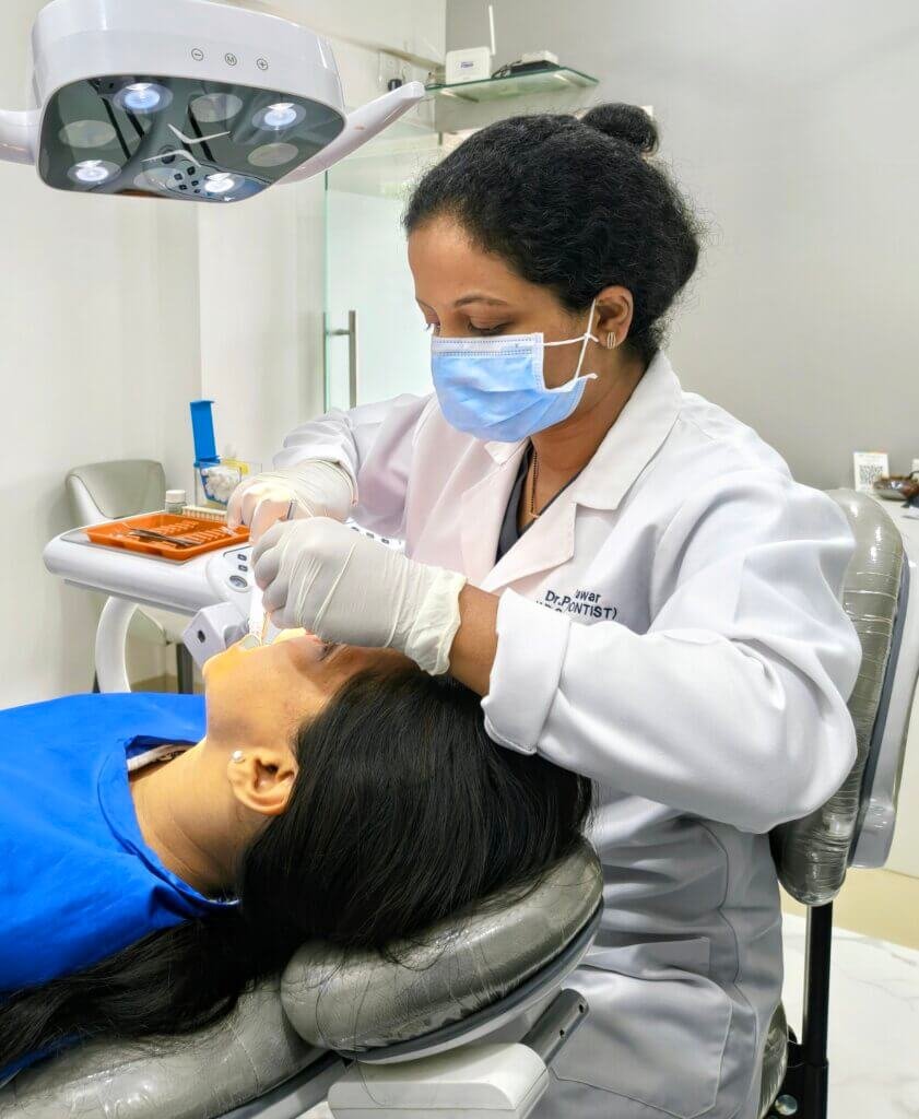 Dentist in Thane West Dentist performing a painless tooth-colored dental filling procedure for a patient at Dr. Pawar's Advanced Dentistry in Thane West.